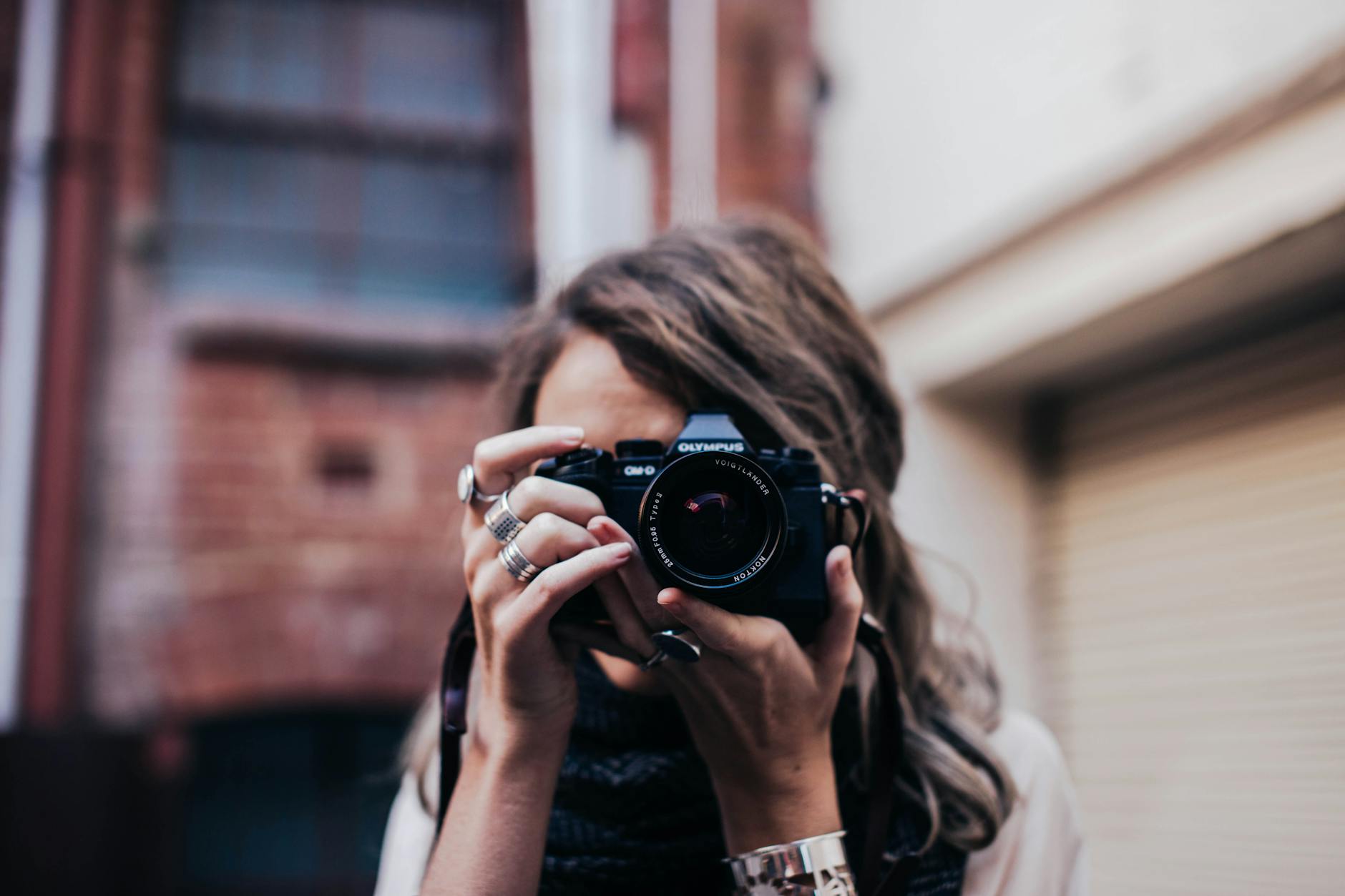 anonymous woman with photo camera