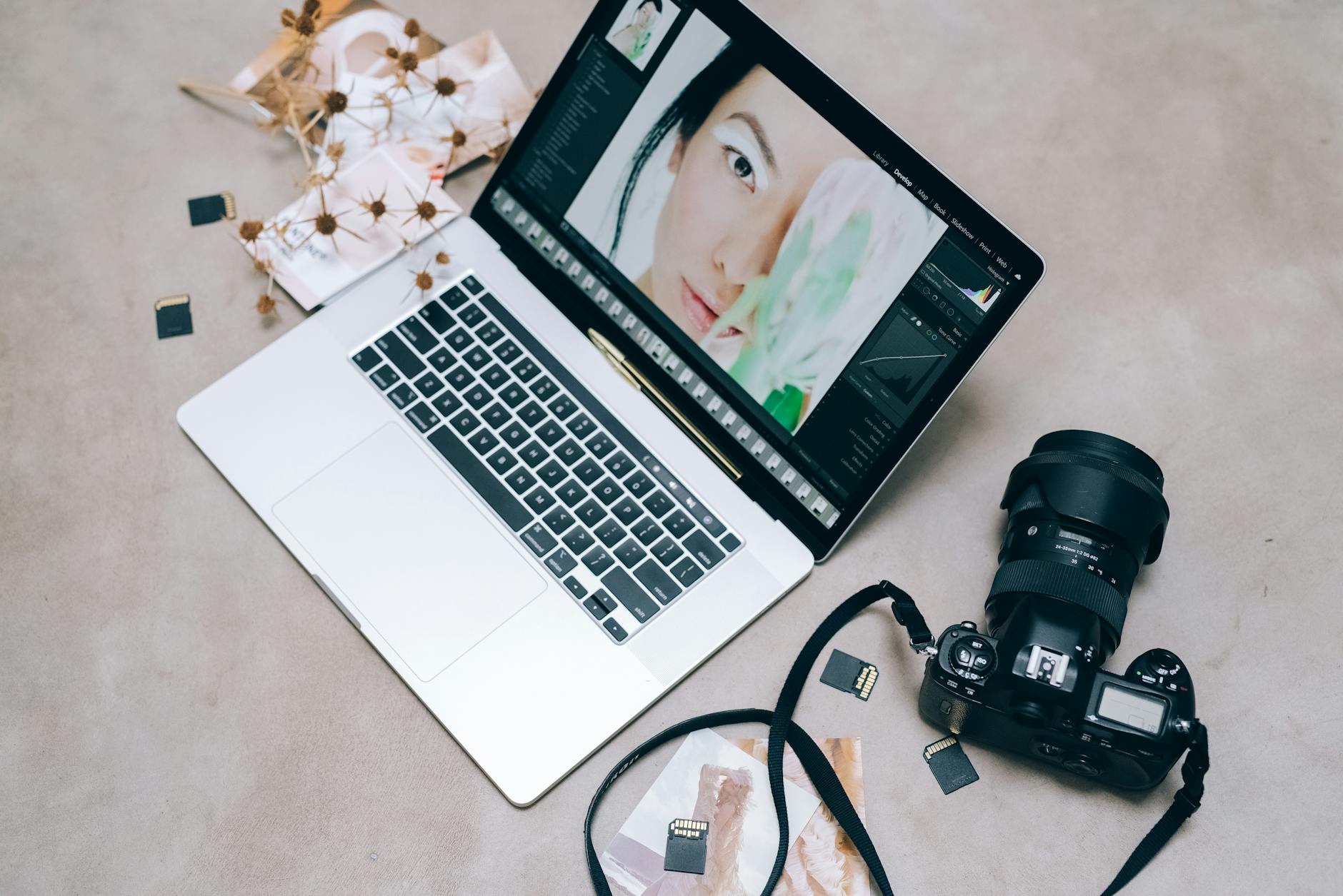 high angle shot of a laptop and camera