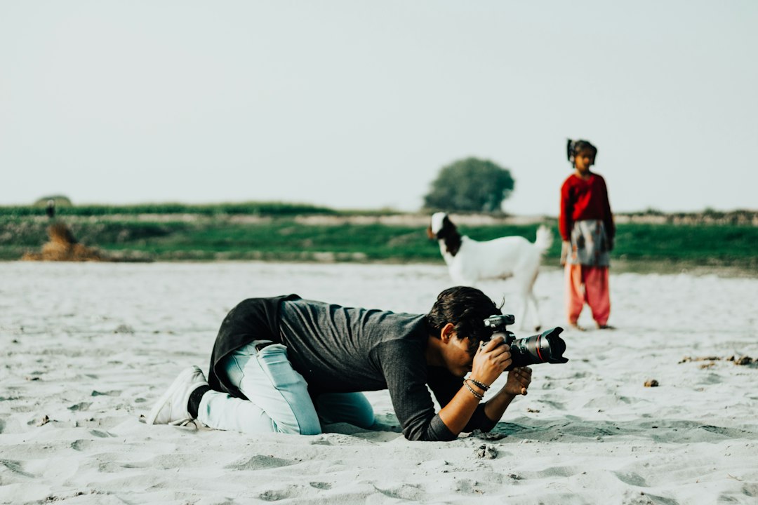 Photographer taking a quiet break with their camera, reflecting on when photography stops feeling fun