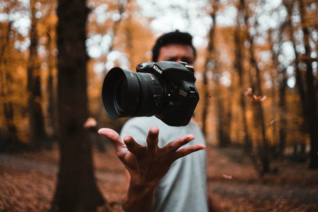 Photographer pausing to compose a deliberate, unhurried shot instead of rushing the frame